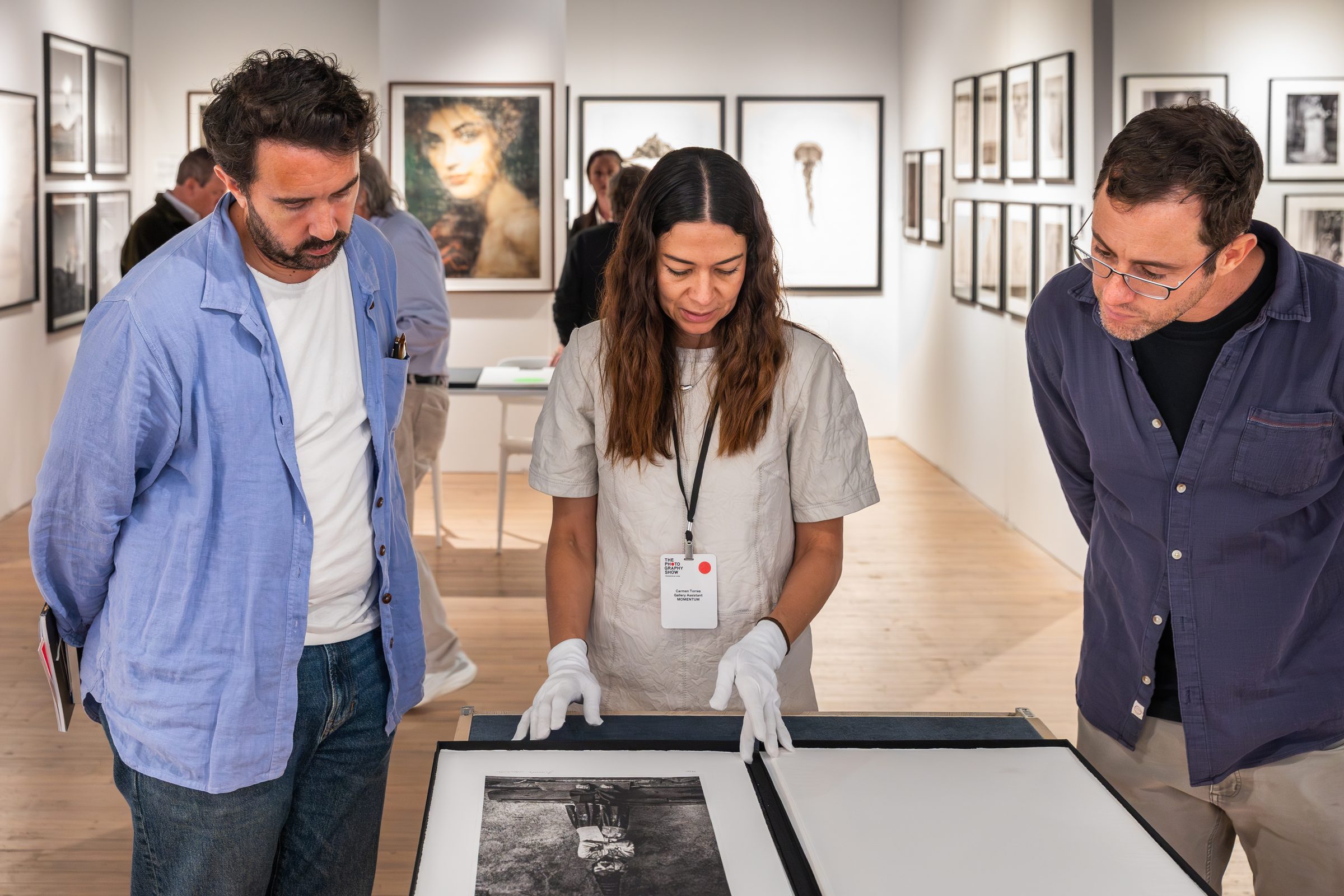 The Photography Show, AIPAD — viewing a print at the fair