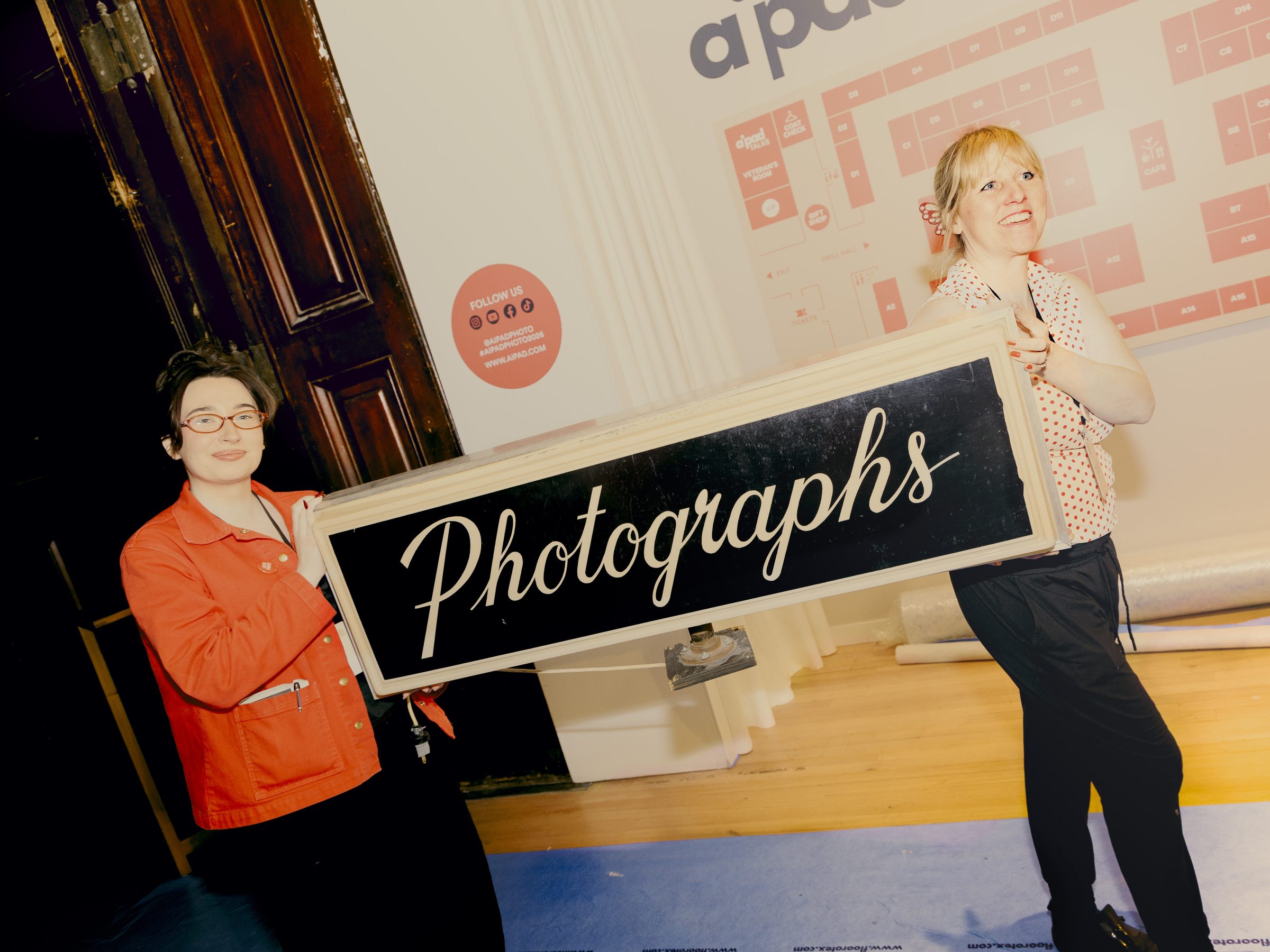 The Photography Show, AIPAD — installing the Photographs sign