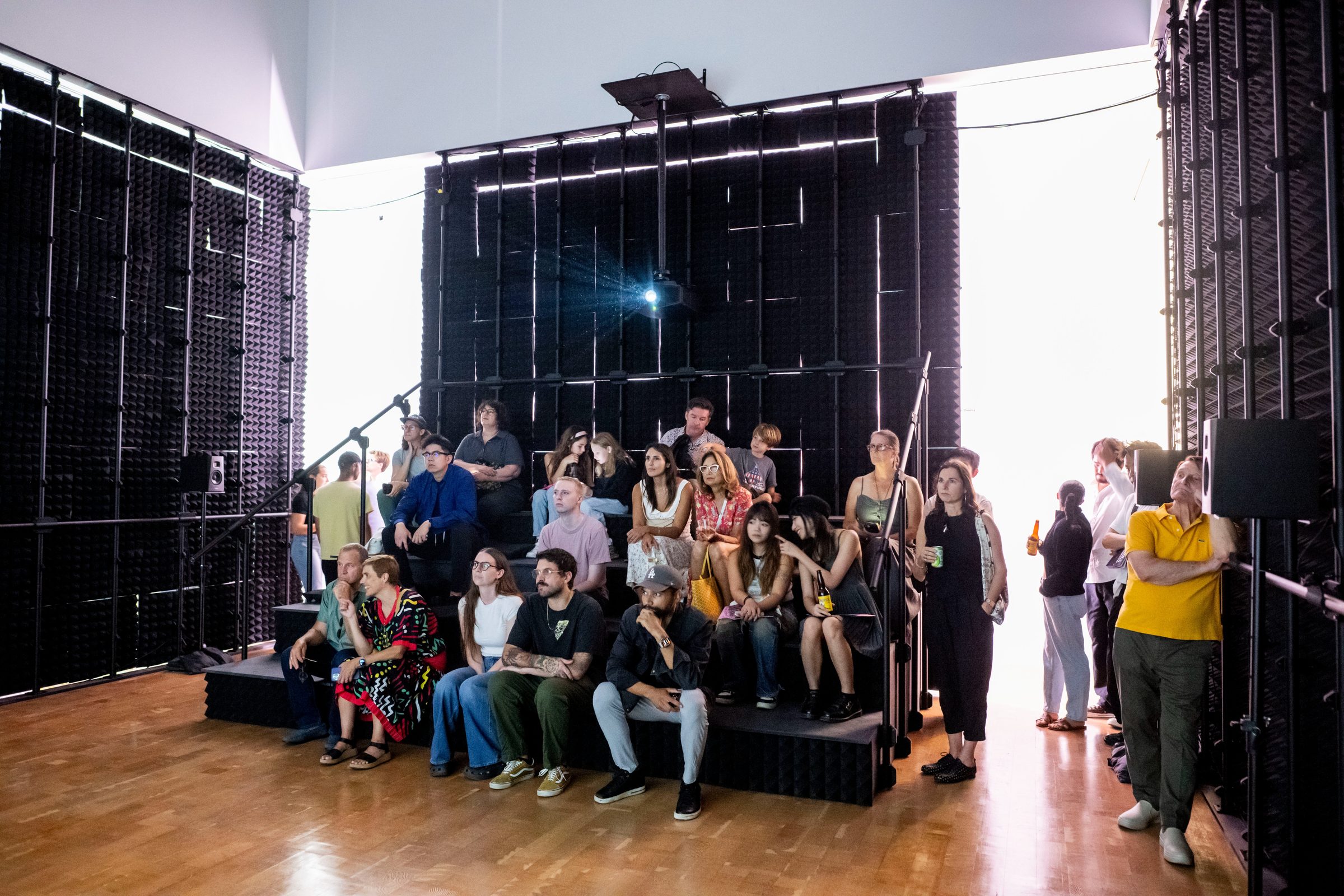 Views of Planet City — visitors before the woven mural